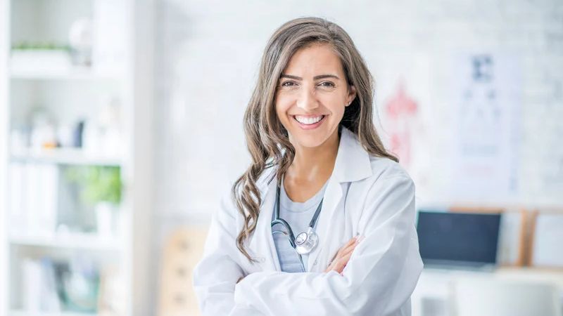 a woman in a white coat